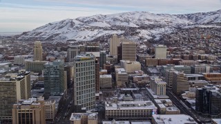 5.5K aerial stock footage fly over State Street and Downtown Salt Lake City buildings with snow at sunrise, Utah Aerial Stock Footage | AX124_212E