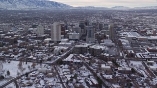 5.5K aerial stock footage orbit snowy Utah State Capitol to approach Downtown Salt Lake City in winter at sunrise Aerial Stock Footage | AX124_220E