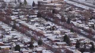 5.5K aerial stock footage orbit Salt Lake City suburbs with snow at sunrise, Utah Aerial Stock Footage | AX124_232