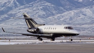 5.5K aerial stock footage track jet airplane in winter at the Salt Lake City International Airport at sunrise in Utah Aerial Stock Footage | AX124_235E