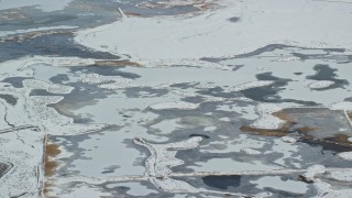 5.5K aerial stock footage of ice and frozen marshland with winter snow near Salt Lake City, Utah Aerial Stock Footage | AX125_020