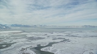 5.5K aerial stock footage of snow mountains across the Great Salt Lake in Utah Aerial Stock Footage | AX125_024