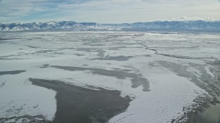 5.5K aerial stock footage of frozen marshlands outside of Salt Lake City in winter, Utah Aerial Stock Footage | AX125_104E