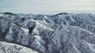 5.5K aerial stock footage of rugged Oquirrh Mountains with snow in wintertime, Utah Aerial Stock Footage | AX125_161E