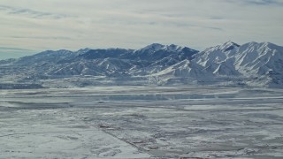 5.5K aerial stock footage of white snow on the Oquirrh Mountains of Utah in wintertime Aerial Stock Footage | AX125_316E