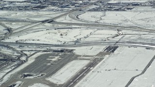 5.5K aerial stock footage track airliner lifting off from SLC International Airport in winter, Utah Aerial Stock Footage | AX125_327