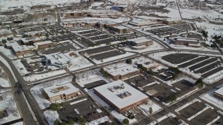 5.5K aerial stock footage of office buildings in Salt Lake City with winter snow, Utah Aerial Stock Footage | AX126_060E