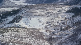 5.5K aerial stock footage approach Utah Olympic Park with winter snow, Park City, Utah Aerial Stock Footage | AX126_094