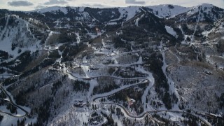 5.5K aerial stock footage orbiting mountainside mansions with winter snow in Park City, Utah Aerial Stock Footage | AX126_116