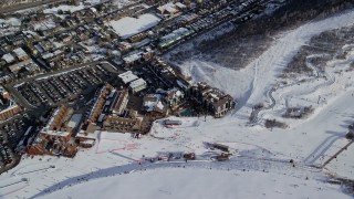 5.5K aerial stock footage video of ski resort hotels at the bottom of a ski run in winter, Park City, Utah Aerial Stock Footage | AX126_165E