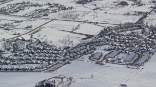 5.5K aerial stock footage orbit tract homes with snowy rooftops in the small town of Midway, Utah Aerial Stock Footage | AX126_200