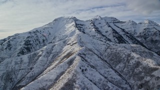 5.5K aerial stock footage of tall Mount Timpanogos with winter snow in Utah Aerial Stock Footage | AX126_243E