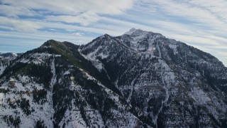 5.5K aerial stock footage flyby peaks with snowy slopes and evergreens in wintertime, Wasatch Range, Utah Aerial Stock Footage | AX126_246E