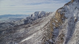 5.5K aerial stock footage of rocky slopes of Mount Timpanogos with winter snow in Utah Aerial Stock Footage | AX126_252E