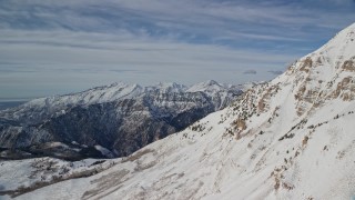 5.5K aerial stock footage of Wasatch Range snow mountains and the north end of Mount Timpanogos in Utah Aerial Stock Footage | AX126_267E