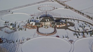 5.5K aerial stock footage approach mansion surrounded by snowy fields in winter, Heber City, Utah Aerial Stock Footage | AX126_321E