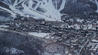 5.5K aerial stock footage of center of town in Park City with light winter snow at sunset, Utah Aerial Stock Footage | AX127_023E