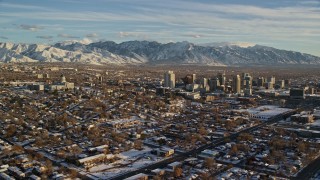 5.5K aerial stock footage orbit of the Utah State Capitol and Downtown Salt Lake City with winter snow at sunset Aerial Stock Footage | AX127_093