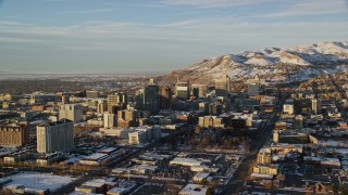 5.5K aerial stock footage orbit Downtown Salt Lake City near Utah State Capitol at sunset with winter snow Aerial Stock Footage | AX127_107E