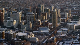 5.5K aerial stock footage of Salt Lake Temple, Tabernacle and Assembly Hall in downtown with winter snow at sunset, Utah Aerial Stock Footage | AX127_121E