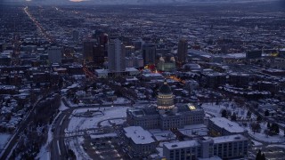 5.5K aerial stock footage fly over Utah State Capitol toward church buildings and temple with snow at twilight, Downtown Salt Lake City Aerial Stock Footage | AX128_022E