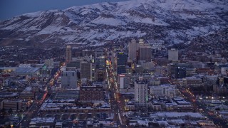 5.5K aerial stock footage of Utah State Capitol and downtown with winter snow seen from southeast of Salt Lake City at twilight Aerial Stock Footage | AX128_036E