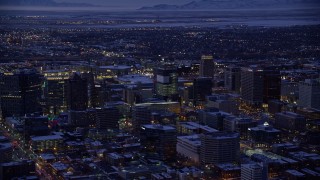 5.5K aerial stock footage of orbiting buildings in Downtown SLC, Utah with winter snow at twilight Aerial Stock Footage | AX128_059