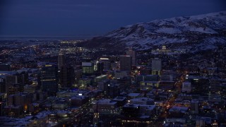 5.5K aerial stock footage of southeast side of Downtown SLC and capitol with winter snow at night, Utah Aerial Stock Footage | AX128_061E