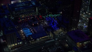 5.5K aerial stock footage orbit Christmas tree at Gallivan Center with winter snow at night, Downtown Salt Lake City, Utah Aerial Stock Footage | AX128_092E