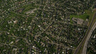 5.5K aerial stock footage bird's eye view suburban homes, green Wasatch Range slopes, Salt Lake City, Utah Aerial Stock Footage | AX129_092E