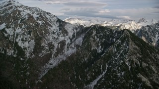 5.5K aerial stock footage video of flying by snow-capped peaks and ridges of the Wasatch Range, Utah Aerial Stock Footage | AX129_106E