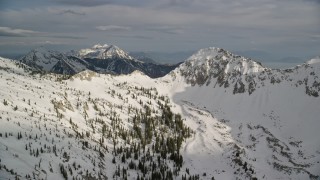 5.5K aerial stock footage of approaching a distant mountain peak, from the Wasatch Range, Utah Aerial Stock Footage | AX129_116E