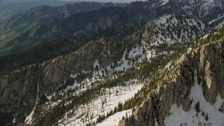 5.5K aerial stock footage pan across Lone Peak in snowy Wasatch Range, Lone Peak, Utah Aerial Stock Footage | AX129_124