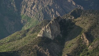 5.5K aerial stock footage of passing by the rocky summit of a mountain ridge, Wasatch Range, Utah Aerial Stock Footage | AX129_131E