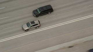 5.5K aerial stock footage video of tracking a black SUV passing light traffic on I-15, Salt Lake City, Utah Aerial Stock Footage | AX130_015E