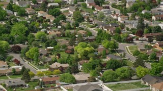 5.5K aerial stock footage of flying by suburban neighborhood, West Jordan, Utah Aerial Stock Footage | AX130_022