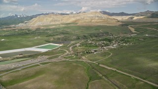 AX130_029E - 5.5K aerial stock footage of approaching Bingham Canyon Mine (Kennecott Copper Mine), Copperton, Utah