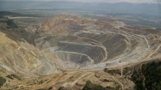 5.5K aerial stock footage of an orbit around the Bingham Canyon Mine (Kennecott Copper Mine), Utah Aerial Stock Footage | AX130_047E