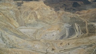 5.5K aerial stock footage of a view of the bottom of Bingham Canyon Mine (Kennecott Copper Mine), Utah Aerial Stock Footage | AX130_052E