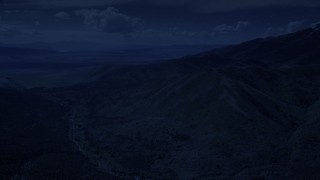 4K day for night color corrected aerial footage of approaching rugged mountain ridges, Oquirrh Mountains, Utah Aerial Stock Footage | AX130_064_DFN