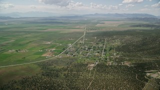 5.5K aerial stock footage approach and tilt to small town rural neighborhood, Cedar Fort, Utah Aerial Stock Footage | AX130_072E