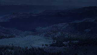 4K day for night color corrected aerial footage of flying over mountains, trees in Wasatch Range, Utah Aerial Stock Footage | AX130_129_DFN