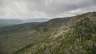 5.5K aerial stock footage of flying by mountain slopes, aspen and evergreen trees, Fishlake National Forest, Utah Aerial Stock Footage | AX130_206E