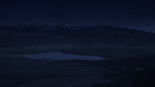 4K day for night color corrected aerial footage flyby Koosharem Reservoir, snowy mountains in background, Fishlake National Forest, Utah Aerial Stock Footage | AX130_210_DFN