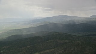 5.5K aerial stock footage of rain falling on mountains in Fishlake National Forest, Utah Aerial Stock Footage | AX130_213