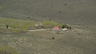 5.5K aerial stock footage of flying over isolated rural homes, Fishlake National Forest, Utah Aerial Stock Footage | AX130_220