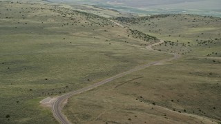 5.5K aerial stock footage of flying by deserted road through the hills, Fishlake National Forest, Utah Aerial Stock Footage | AX130_221E