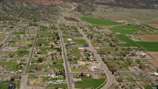 5.5K aerial stock footage of orbiting Wayne High School in small rural town, Bicknell, Utah Aerial Stock Footage | AX130_237E