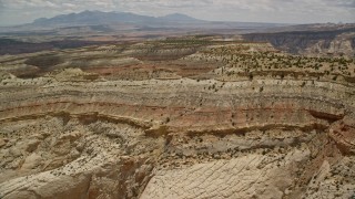 5.5K aerial stock footage fly over and approach mesas, Capitol Reef National Park, Utah Aerial Stock Footage | AX130_290E