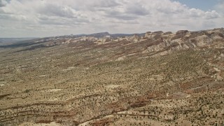 5.5K aerial stock footage of approaching the Waterpocket Fold rock formations, Capitol Reef National Park, Utah Aerial Stock Footage | AX130_300E